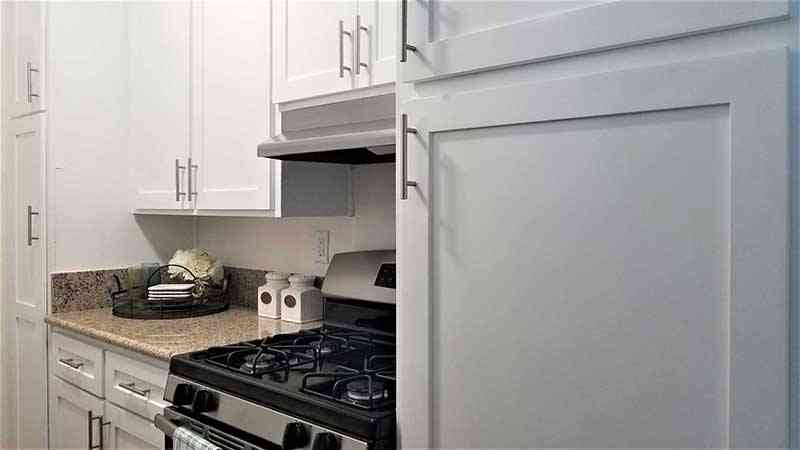 renovated kitchen with white shaker cabinets