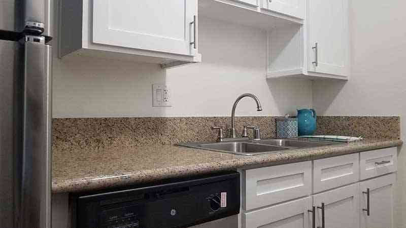 updated kitchen with dishwasher and ample counter space