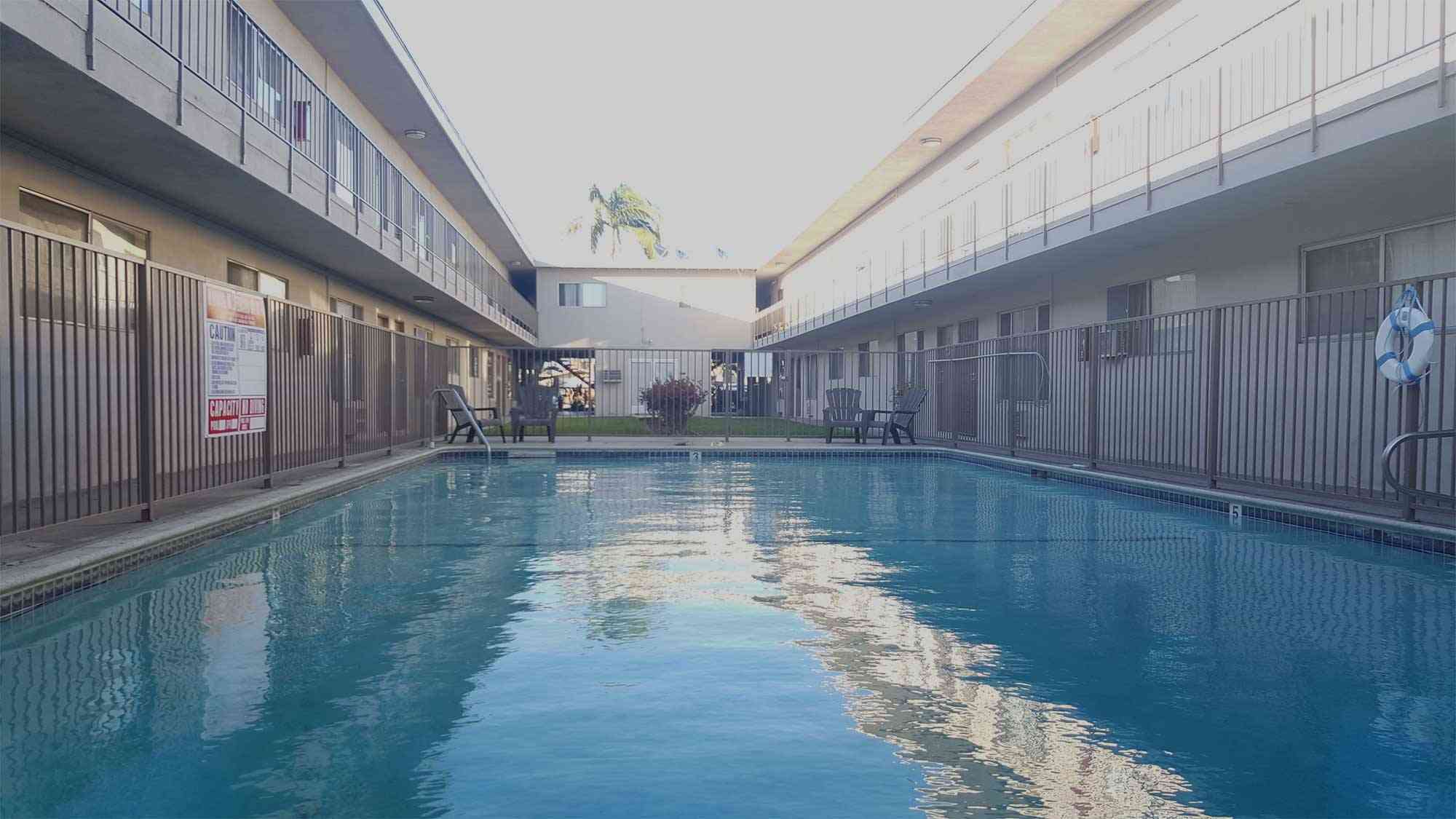 refreshing resident pool with safety fencing