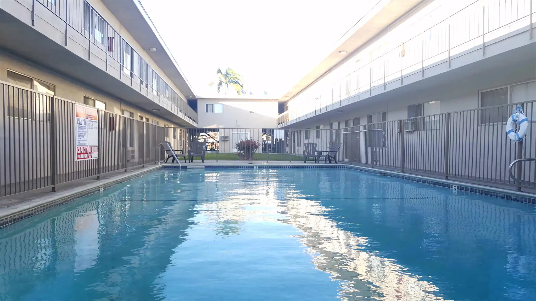 Burke Apartments refreshing resident pool with safety fencing
